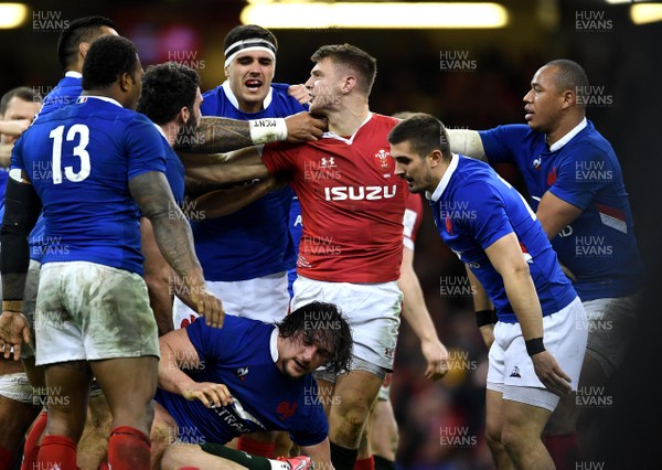 220220 - Wales v France - Guinness Six Nations - Dan Biggar of Wales gets caught by France players at the end of the game at tempers flare
