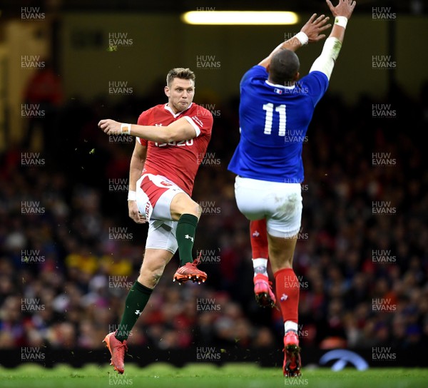 220220 - Wales v France - Guinness Six Nations - Dan Biggar of Wales kicks past Gael Fickou of France