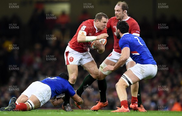 220220 - Wales v France - Guinness Six Nations - Hadleigh Parkes of Wales is tackled by Francois Cros and Charles Ollivon of France
