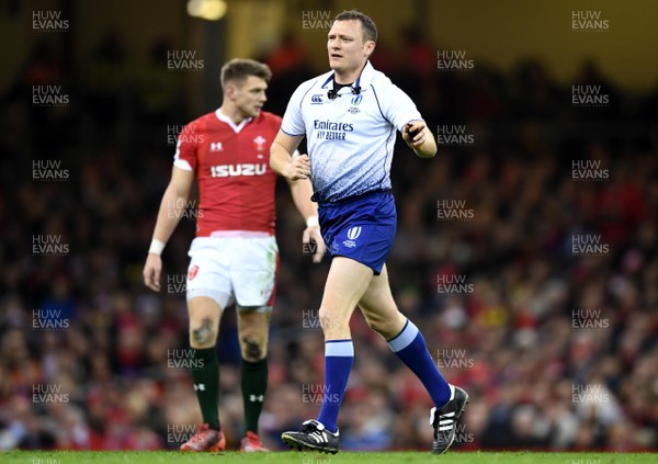 220220 - Wales v France - Guinness Six Nations - Referee Matthew Carley as Dan Biggar of Wales looks on