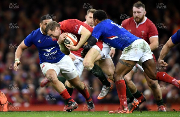 220220 - Wales v France - Guinness Six Nations - Hadleigh Parkes of Wales is tackled by Virimi Vakatawa of France