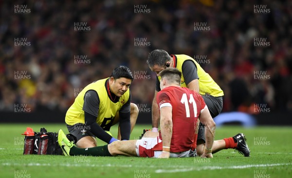 220220 - Wales v France - Guinness Six Nations - Josh Adams of Wales is treated for injury by Prav Mathema and Dr Geoff Davies