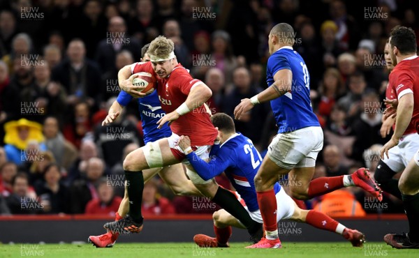 220220 - Wales v France - Guinness Six Nations - Aaron Wainwright of Wales is tackled by Baptiste Serin of France