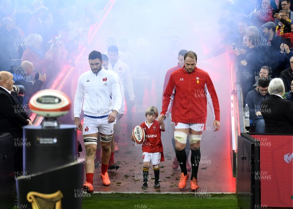 220220 - Wales v France - Guinness Six Nations - Charles Ollivon of France and Alun Wyn Jones of Wales lead out their side with mascot