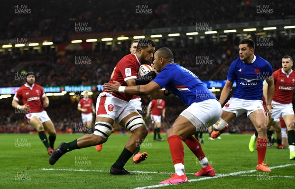 220220 - Wales v France - Guinness Six Nations - Taulupe Faletau of Wales is tackled by Gael Fickou of France