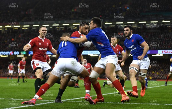 220220 - Wales v France - Guinness Six Nations - Taulupe Faletau of Wales is tackled by Gael Fickou and Arthur Vincent of France