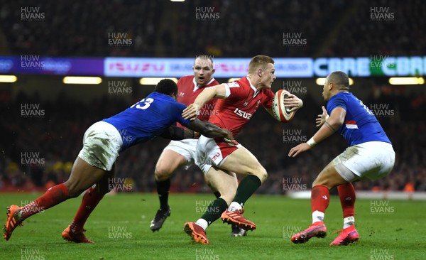 220220 - Wales v France - Guinness Six Nations - Johnny McNicholl of Wales is tackled by Virimi Vakatawa of France 