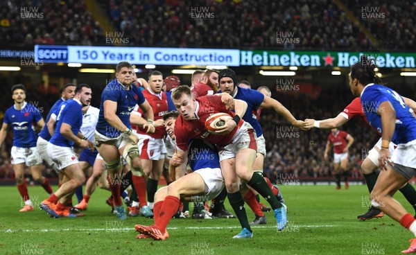 220220 - Wales v France - Guinness Six Nations - Nick Tompkins of Wales is tackled by Antoine Dupont of France