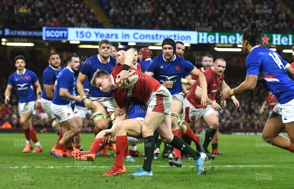 220220 - Wales v France - Guinness Six Nations - Nick Tompkins of Wales is tackled by Antoine Dupont of France