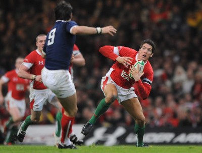 26.02.10 - Wales v France - RBS Six Nations 2010 - James Hook of Wales takes on Morgan Parra of France. 