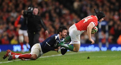 26.02.10 - Wales v France - RBS Six Nations 2010 - Leigh Halfpenny of Wales is tackled by Clement Poitrenaud of France. 