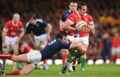 26.02.10 - Wales v France - RBS Six Nations 2010 - Lee Byrne of Wales is tackled by Morgan Parra of France. 