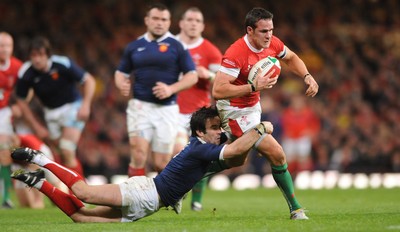 26.02.10 - Wales v France - RBS Six Nations 2010 - Lee Byrne of Wales is tackled by Morgan Parra of France. 