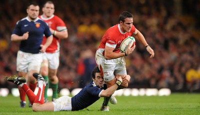 26.02.10 - Wales v France - RBS Six Nations 2010 - Lee Byrne of Wales is tackled by Morgan Parra of France. 