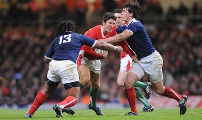 26.02.10 - Wales v France - RBS Six Nations 2010 - James Hook of Wales takes on Mathieu Bastareaud and Yannick Jauzion of France. 