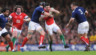 26.02.10 - Wales v France - RBS Six Nations 2010 - Stephen Jones of Wales is tackled by Julien Bonnaire of France. 