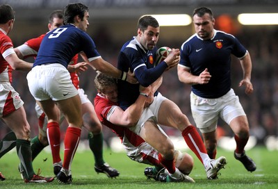 26.02.10 - Wales v France - RBS Six Nations 2010 - Julien Malzieu of France is tackled by Bradley Davies of Wales. 