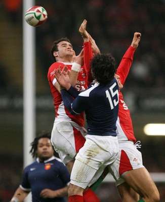 26.02.10 Wales v France... Wales' Jamie Roberts competes with France's Clement Poitrenaud  . 