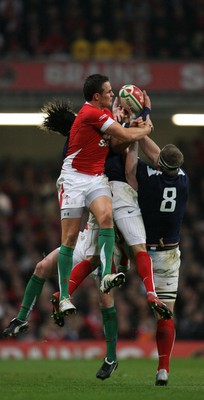 26.02.10 Wales v France... Wales' Lee Byrne competes with France's Mathieu Bastareaud and Imanol Harinordoquy. 
