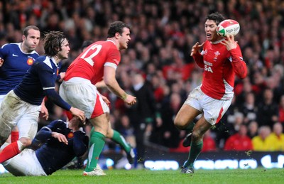 26.02.10 - Six Nations Rugby, Wales v France Wales' James Hook  can't keep hold of the ball as Jamie Roberts  passes 