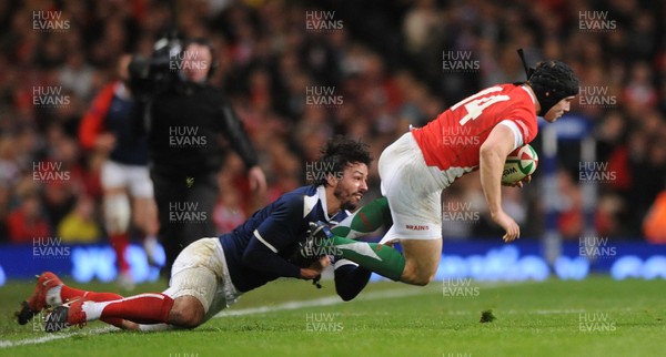 26.02.10 - Wales v France - RBS Six Nations 2010 - Leigh Halfpenny of Wales is tackled by Clement Poitrenaud of France. 