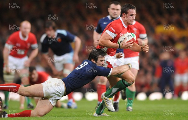 26.02.10 - Wales v France - RBS Six Nations 2010 - Lee Byrne of Wales is tackled by Morgan Parra of France. 