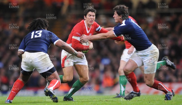 26.02.10 - Wales v France - RBS Six Nations 2010 - James Hook of Wales takes on Mathieu Bastareaud and Yannick Jauzion of France. 