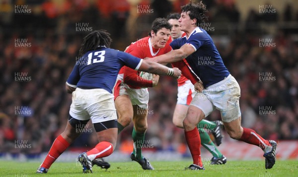 26.02.10 - Wales v France - RBS Six Nations 2010 - James Hook of Wales takes on Mathieu Bastareaud and Yannick Jauzion of France. 
