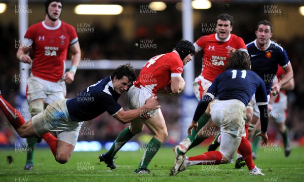 26.02.10 - Wales v France - RBS Six Nations 2010 - Leigh Halfpenny of Wales is tackled by Yannick Jauzion of France. 