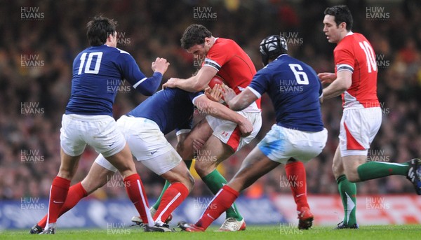 26.02.10 - Wales v France - RBS Six Nations 2010 - Jamie Roberts of Wales is tackled by Yannick Jauzion of France. 