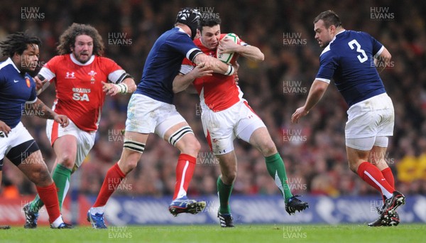 26.02.10 - Wales v France - RBS Six Nations 2010 - Stephen Jones of Wales is tackled by Julien Bonnaire of France. 