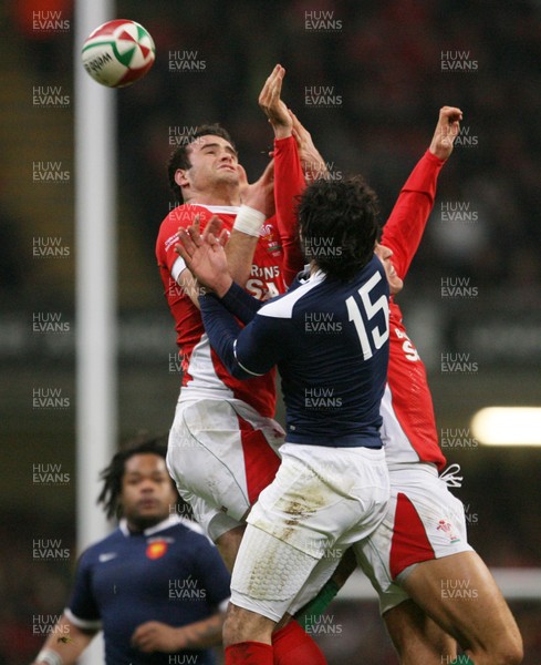 26.02.10 Wales v France... Wales' Jamie Roberts competes with France's Clement Poitrenaud  . 