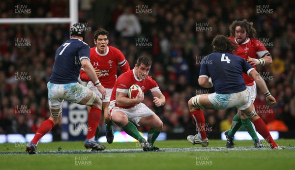 26.02.10 Wales v France... Wales' Huw Bennett tries to get past France's Lionel Nallet and  Julien Bonnaire. 