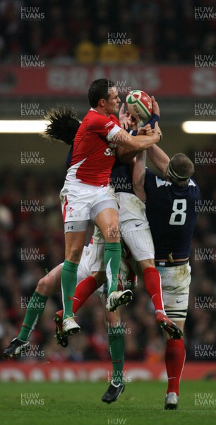 26.02.10 Wales v France... Wales' Lee Byrne competes with France's Mathieu Bastareaud and Imanol Harinordoquy. 