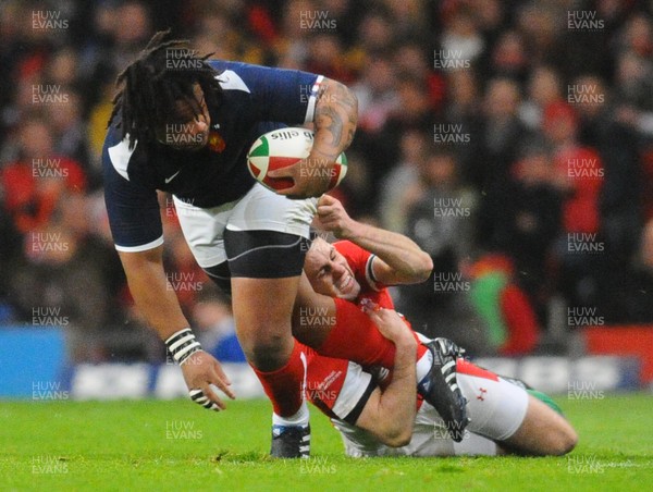 26.02.10 - Six Nations Rugby, Wales v France France's Mathieu Bastareaud is tackled by Wales' Stephen Jones 