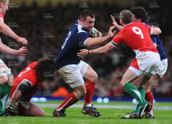26.02.10 - Six Nations Rugby, Wales v France France's Nicolas Mas  tries to get past Wales' Adam Jones  and Richie Rees 