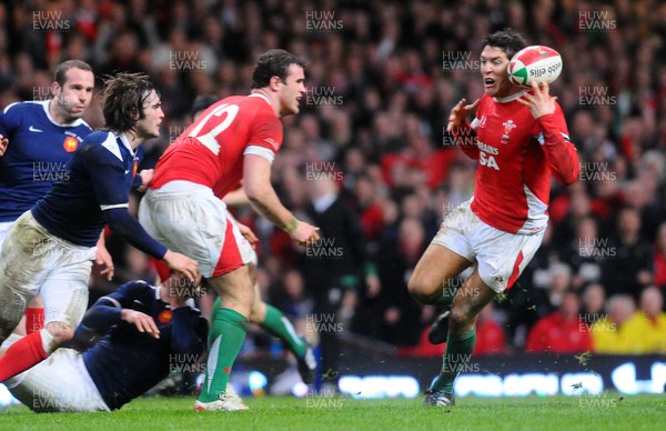 26.02.10 - Six Nations Rugby, Wales v France Wales' James Hook  can't keep hold of the ball as Jamie Roberts  passes 