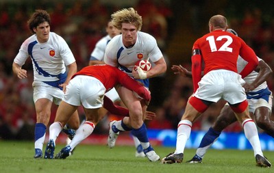 26.08.07 - Wales v France - Invesco Perpetual 2007 Summer Series - France's Remy Martin is tackled by James Hook 