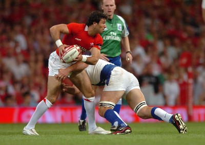 26.08.07 - Wales v France - Invesco Perpetual 2007 Summer Series - Wales' mike Phillips is tackled by France's Fabien Pelous 