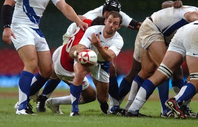 26.08.07 - Wales v France - Invesco Perpetual 2007 Summer Series - France's Jean-Baptiste Elissalde is tackled by Mike Phillips 
