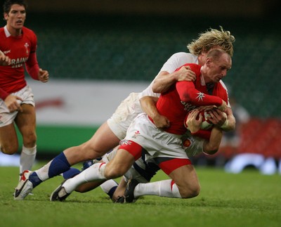 26.08.07  Wales v France... Wales Gareth Thomas is tackled by Remy Martin 