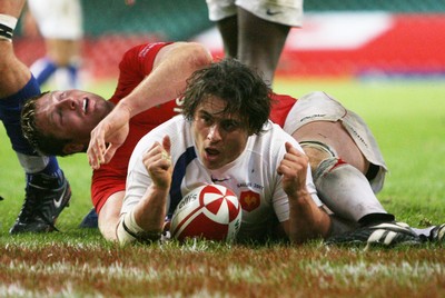 26.08.07  Wales v France... France's Sebastien Bruno scores try despite tackle by Ian Gough 
