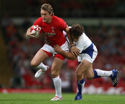 26.08.07 - Wales v France -  Wales' Jamie Robinson is tackled by France's Yannick Jauzion 