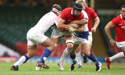 26.08.07 - Wales v France -  Wales' Jonathan Thomas is hauled down by the French defence 
