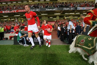 26.08.07  Wales v France... Gareth Thomas and mascot Jonathan David Rees lead out the team. 