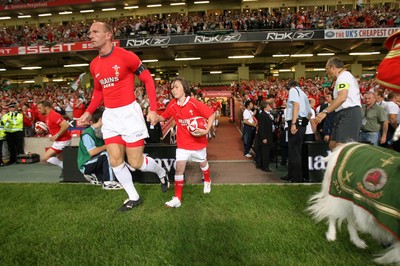 26.08.07  Wales v France... Gareth Thomas and mascot Jonathan David Rees lead out the team. 