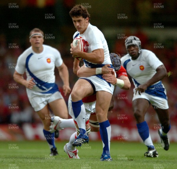 26.08.07 - Wales v France - Invesco Perpetual 2007 Summer Series - France's Yannick Jauzion is tackled by Alun Wyn Jones 