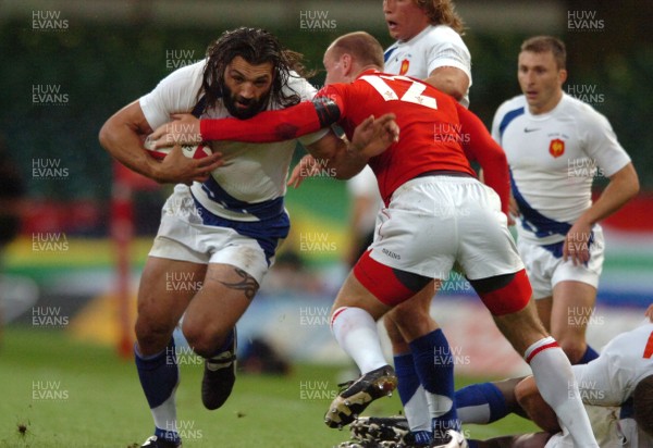 26.08.07 - Wales v France - Invesco Perpetual 2007 Summer Series - France's Sebastien Chabal is tackled by Gareth Thomas 