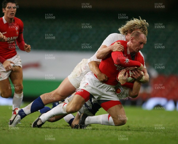 26.08.07  Wales v France... Wales Gareth Thomas is tackled by Remy Martin 
