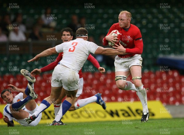 26.08.07  Wales v France... Wales Martyn Williams is tackled by Pieter De Villiers 